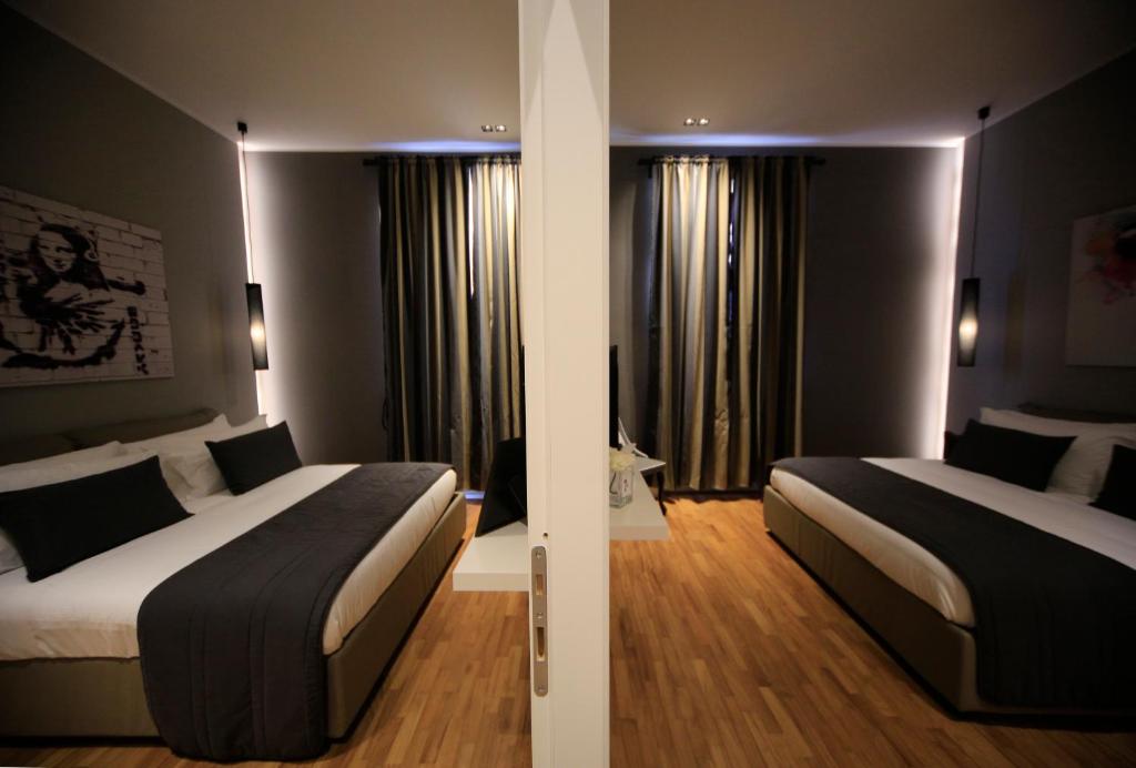 Postel nebo postele na pokoji v ubytování K Rooms