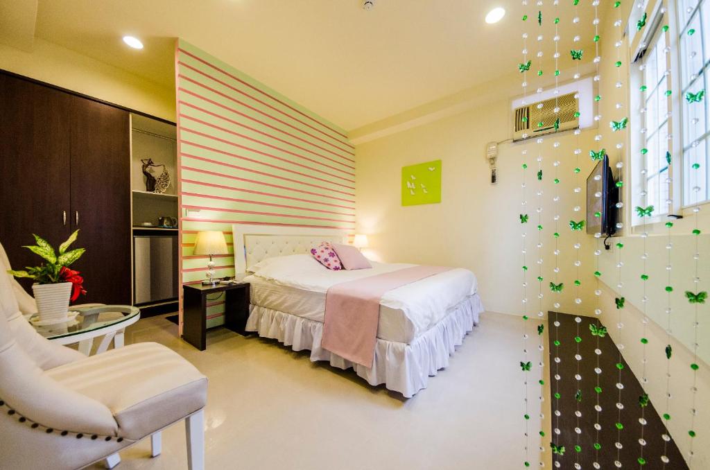 Postel nebo postele na pokoji v ubytování Sunny Breeze Garden Homestay