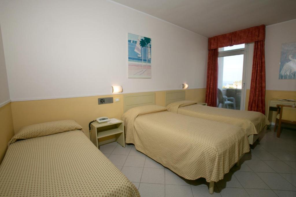 Postel nebo postele na pokoji v ubytování Hotel Salsello