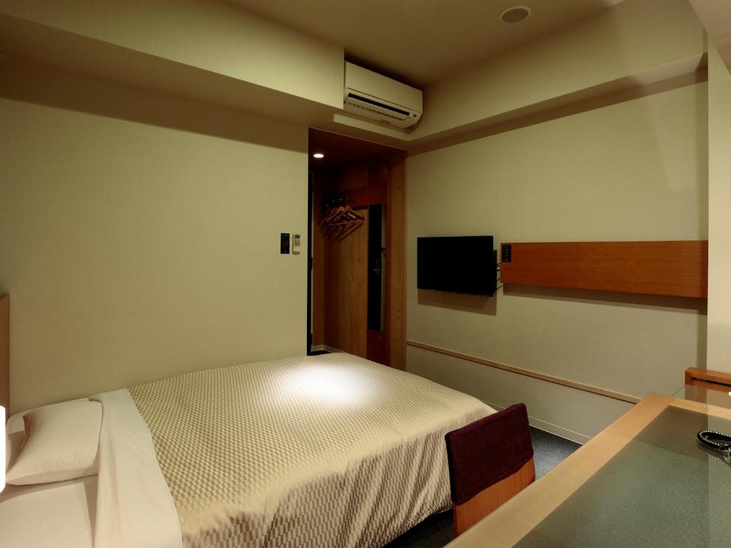 Postel nebo postele na pokoji v ubytování Candeo Hotels Handa
