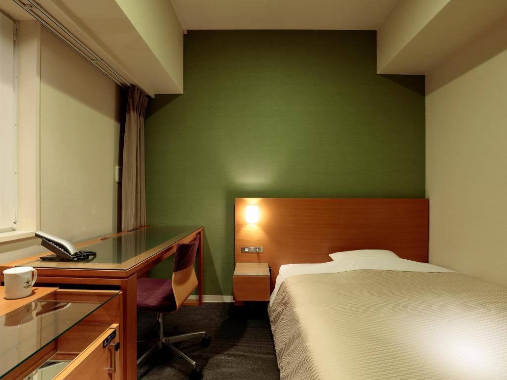 Postel nebo postele na pokoji v ubytování Candeo Hotels Handa