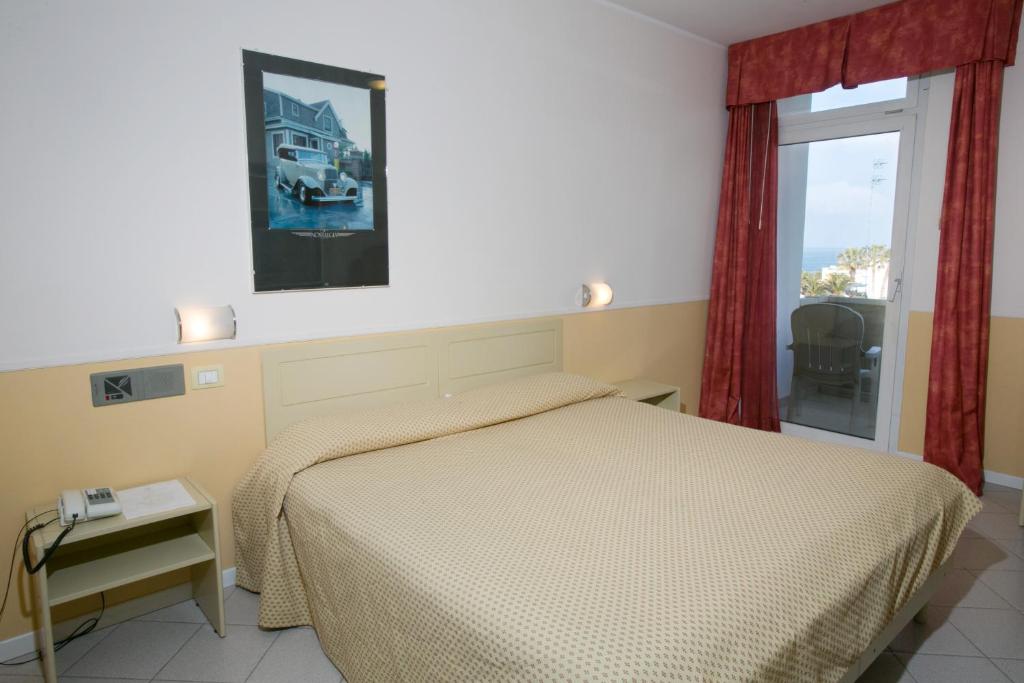 Postel nebo postele na pokoji v ubytování Hotel Salsello