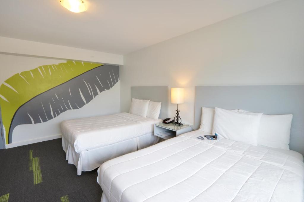 Postel nebo postele na pokoji v ubytování Hotel Miramar