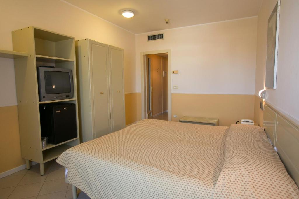 Postel nebo postele na pokoji v ubytování Hotel Salsello