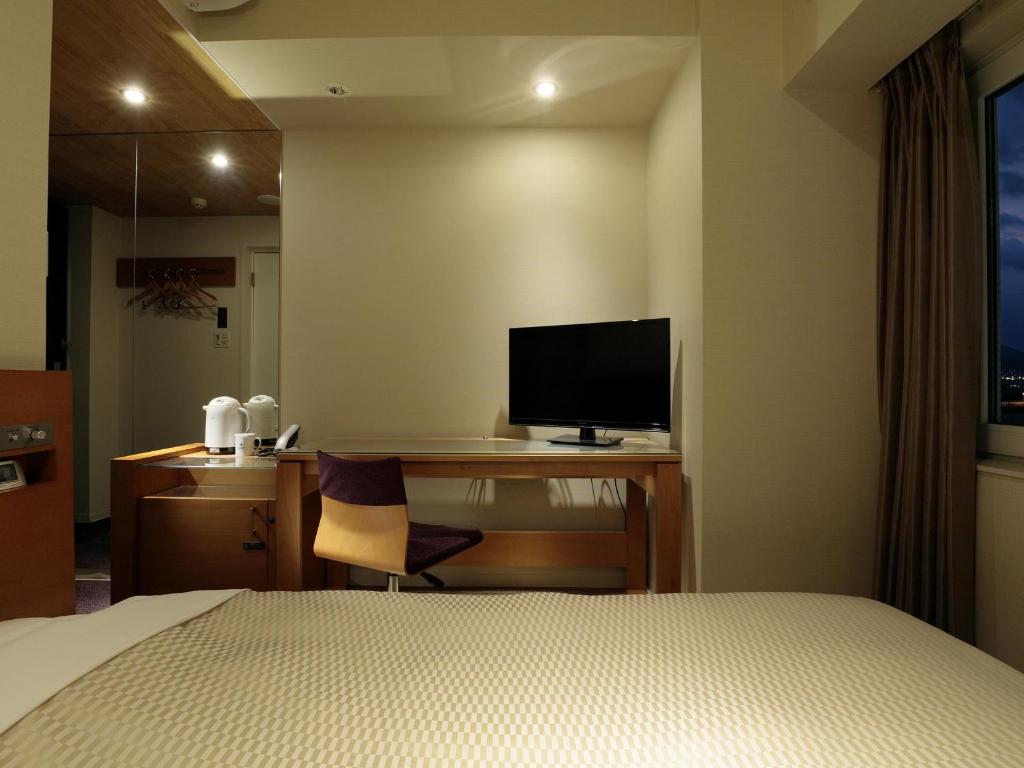 TV a/nebo společenská místnost v ubytování Candeo Hotels Chino