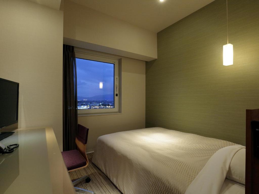 Postel nebo postele na pokoji v ubytování Candeo Hotels Chino