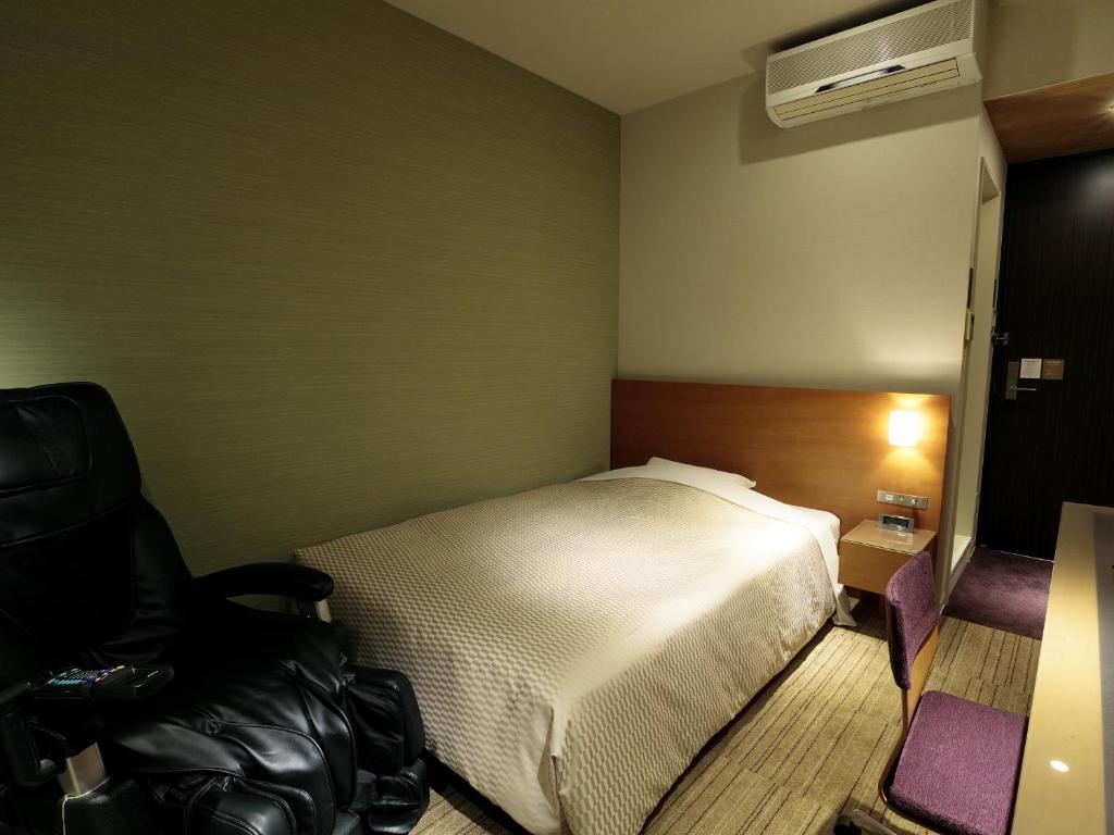 Postel nebo postele na pokoji v ubytování Candeo Hotels Chino