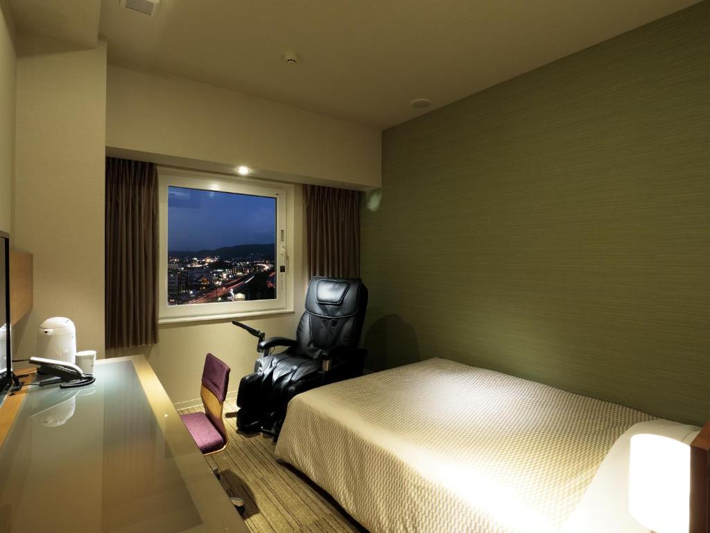 Postel nebo postele na pokoji v ubytování Candeo Hotels Chino
