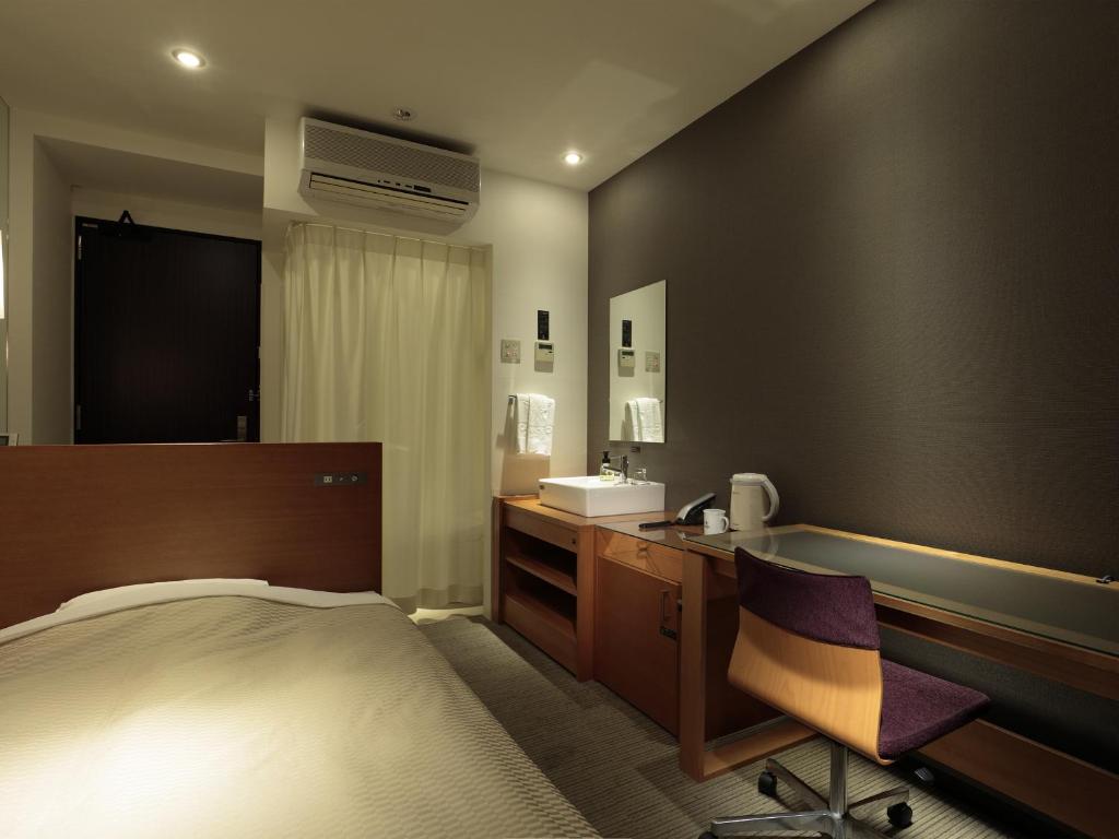 Postel nebo postele na pokoji v ubytování Candeo Hotels Chino