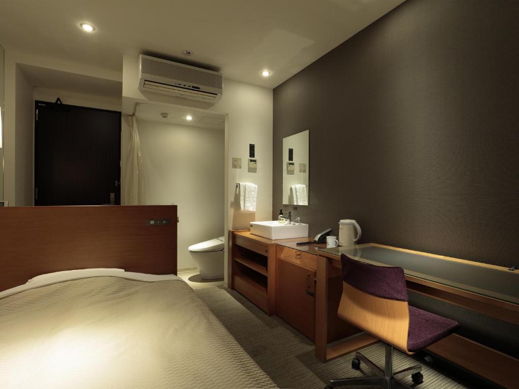 Postel nebo postele na pokoji v ubytování Candeo Hotels Chino