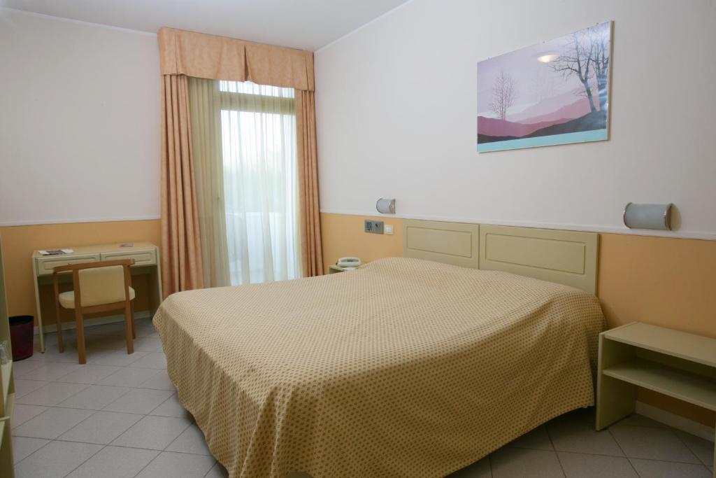Postel nebo postele na pokoji v ubytování Hotel Salsello