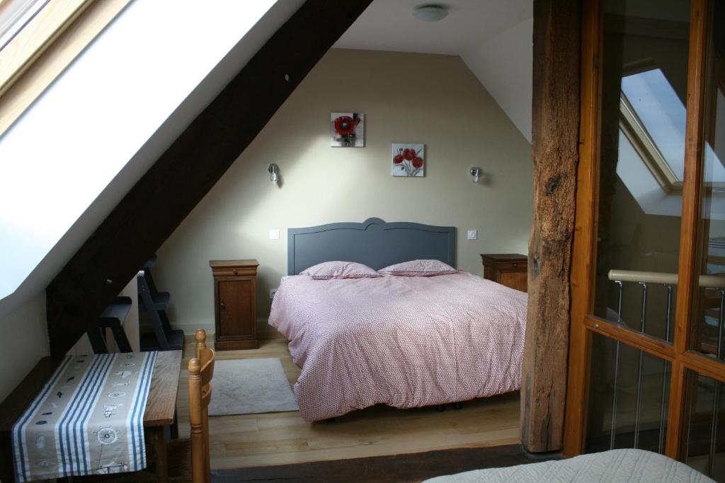 Postel nebo postele na pokoji v ubytování Le Petit Manoir - Jean Gédouin