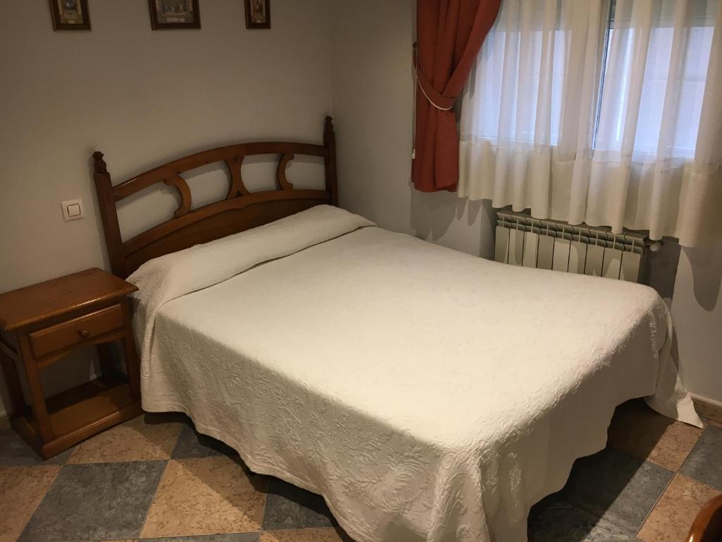 Postel nebo postele na pokoji v ubytování Hostal El Pinar