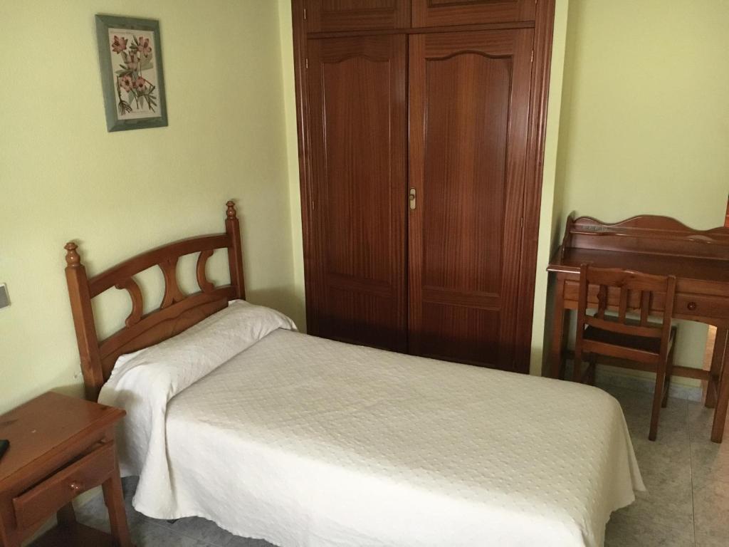 Postel nebo postele na pokoji v ubytování Hostal El Pinar