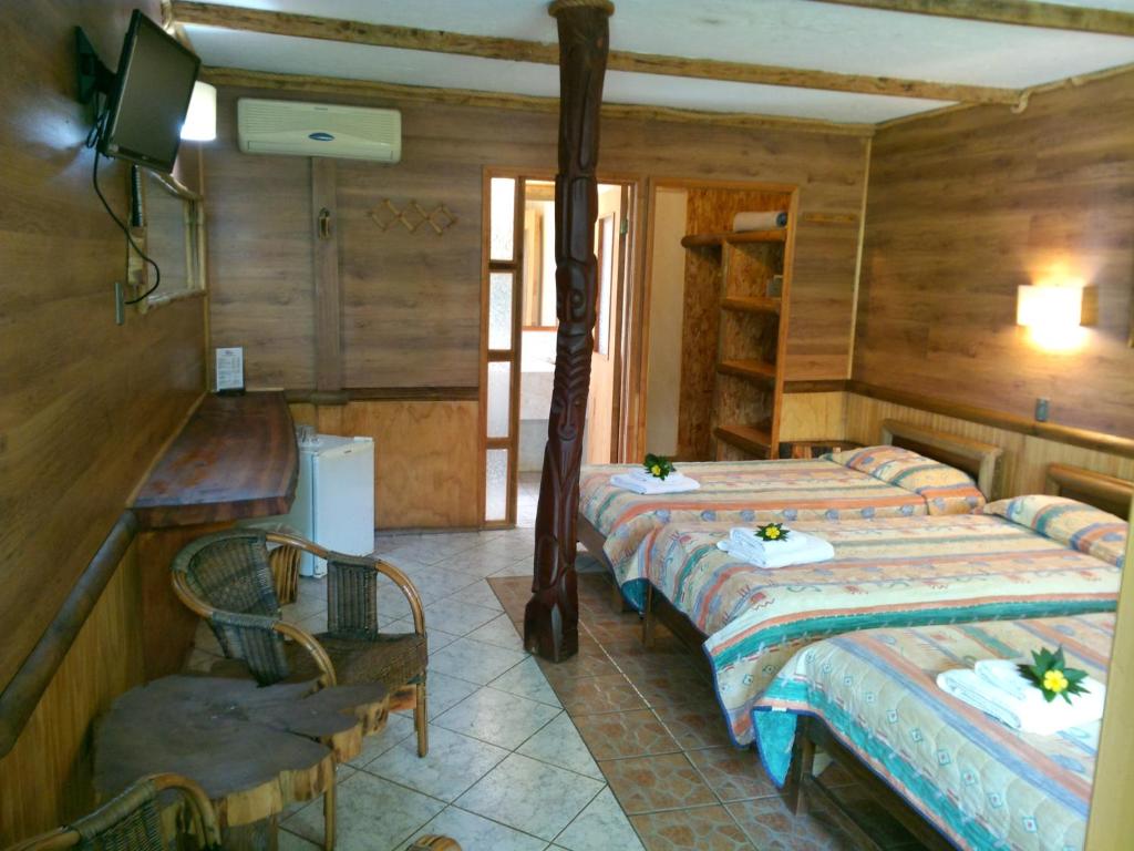 Postel nebo postele na pokoji v ubytování Hotel Manavai