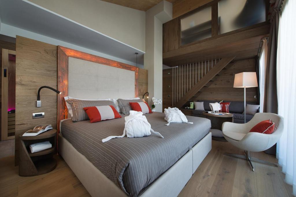 Postel nebo postele na pokoji v ubytování Hotel Baita Montana