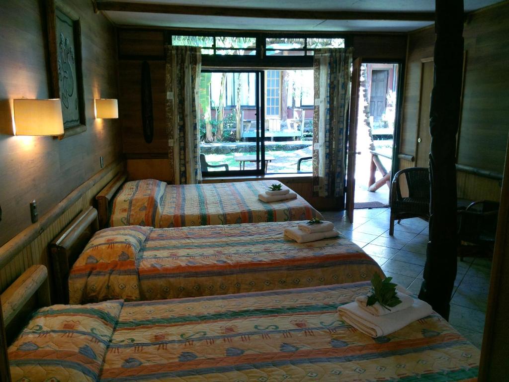Postel nebo postele na pokoji v ubytování Hotel Manavai