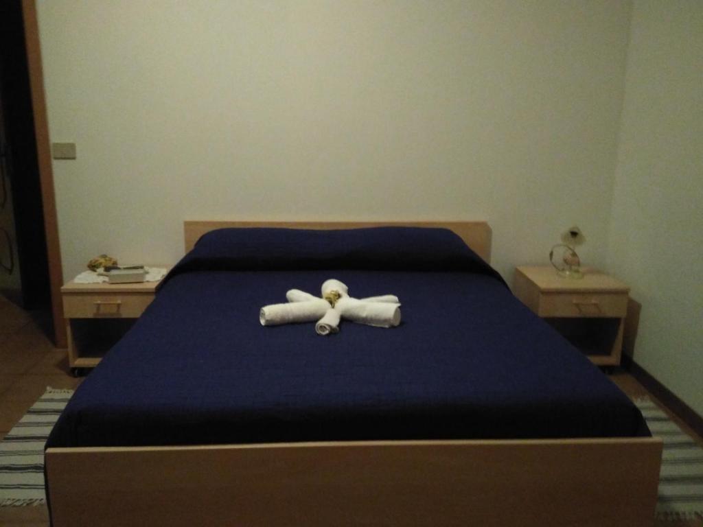 Postel nebo postele na pokoji v ubytování B&B Tufaro Alberico