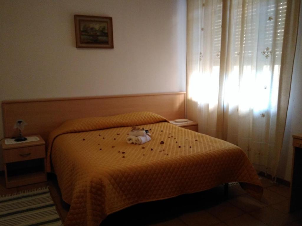 Postel nebo postele na pokoji v ubytování B&B Tufaro Alberico
