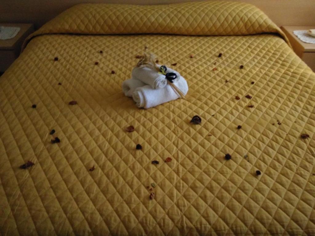 Postel nebo postele na pokoji v ubytování B&B Tufaro Alberico