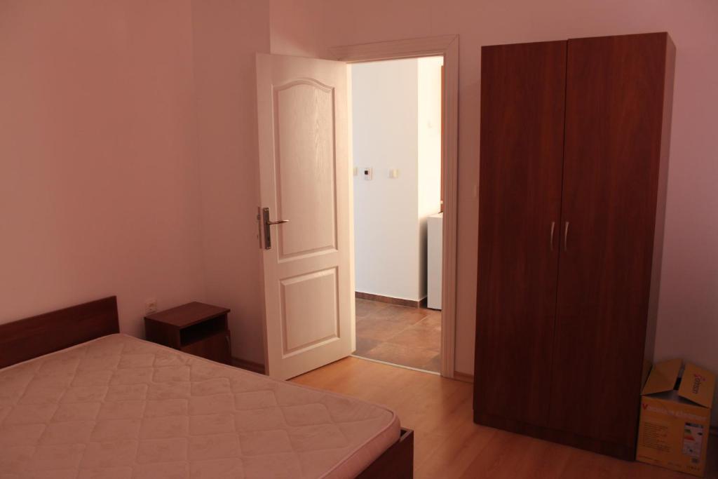 Postel nebo postele na pokoji v ubytování Abelia Residence Apartment Regina