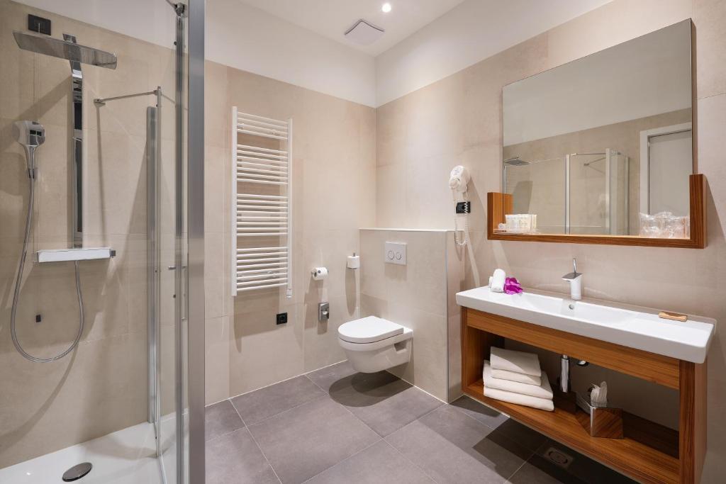 Kúpeľňa v ubytovaní Cornaro Hotel