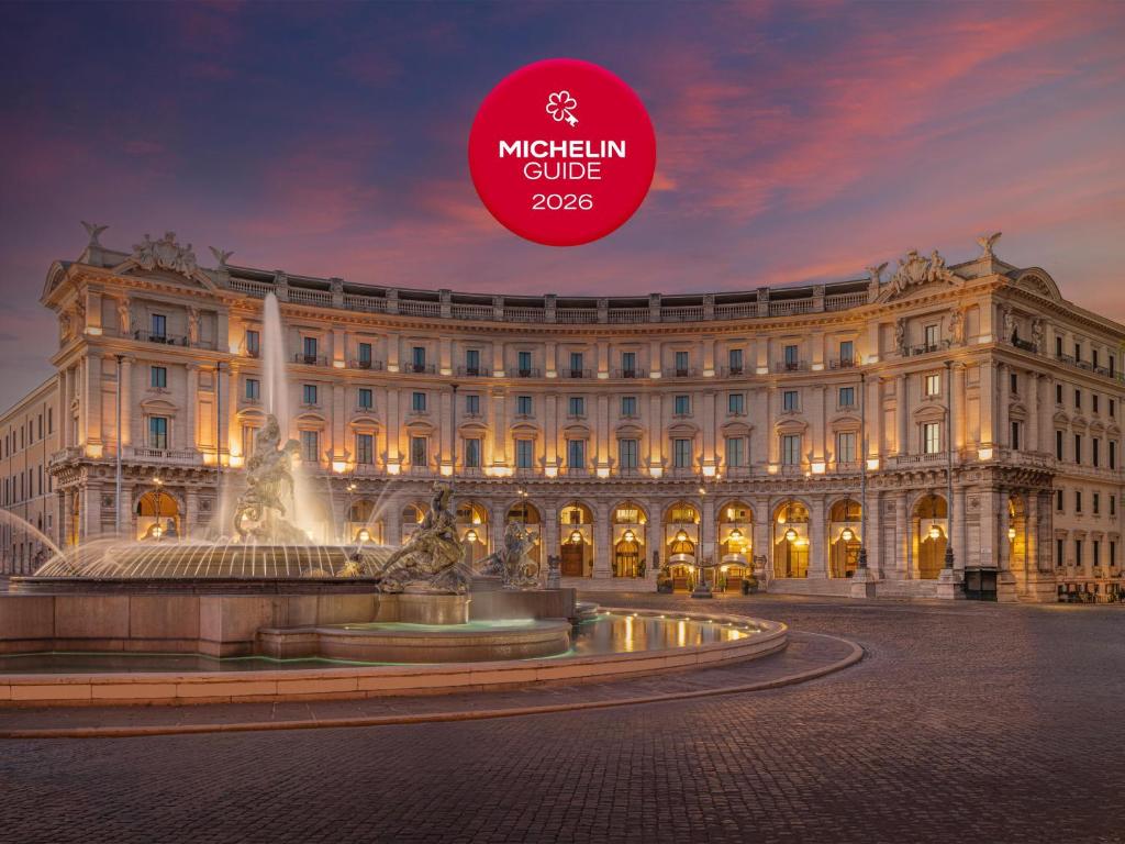 a large building with a fountain in front of it at Anantara Palazzo Naiadi Rome Hotel - A Leading Hotel of the World in Rome