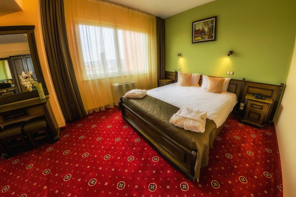 Postel nebo postele na pokoji v ubytování Apollo Wellness Club