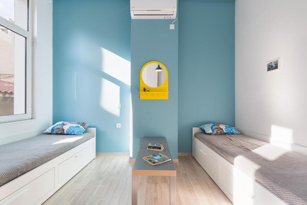 Postel nebo postele na pokoji v ubytování Boutique Central Apartments Acropolis View