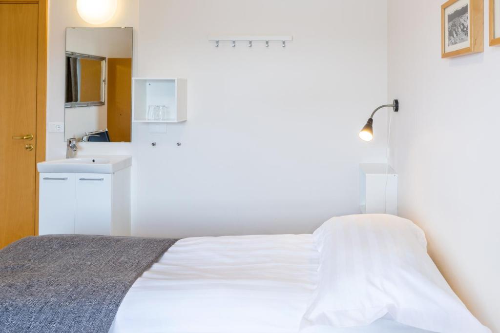 Postel nebo postele na pokoji v ubytování Guesthouse Sunna