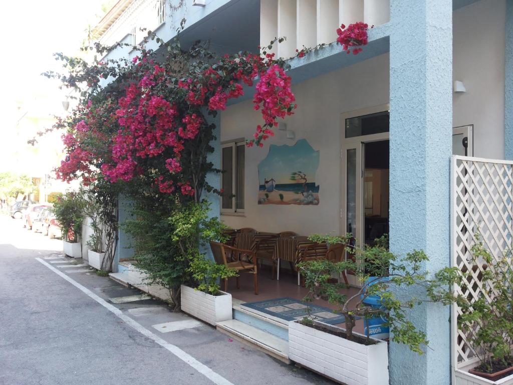 a building with flowers on the side of it at Albergo Lido in Silvi Marina