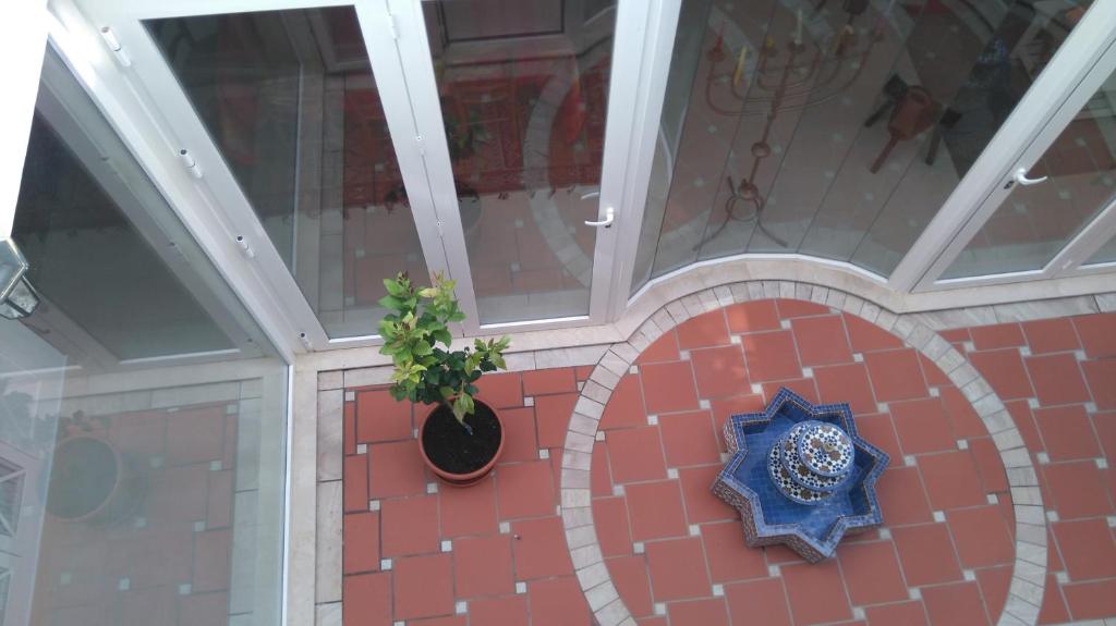 a building with a star on top of a tile floor at Casa Tesoro in Torre del Mar