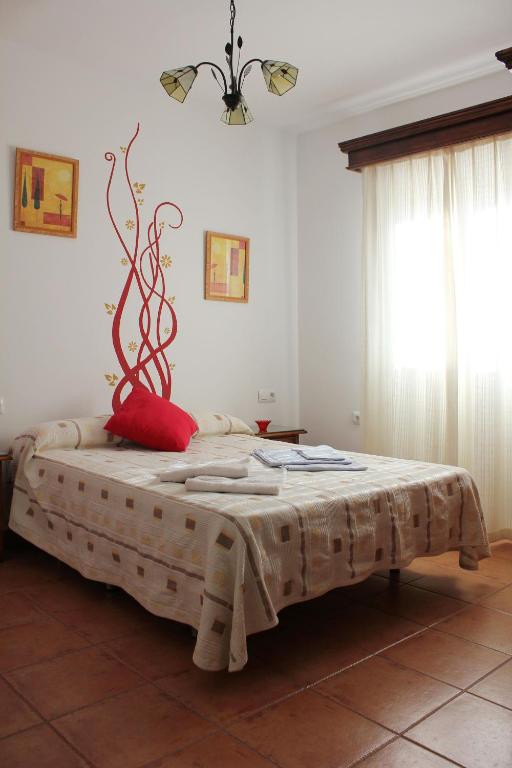 A bed or beds in a room at Casa Gil - La Vega