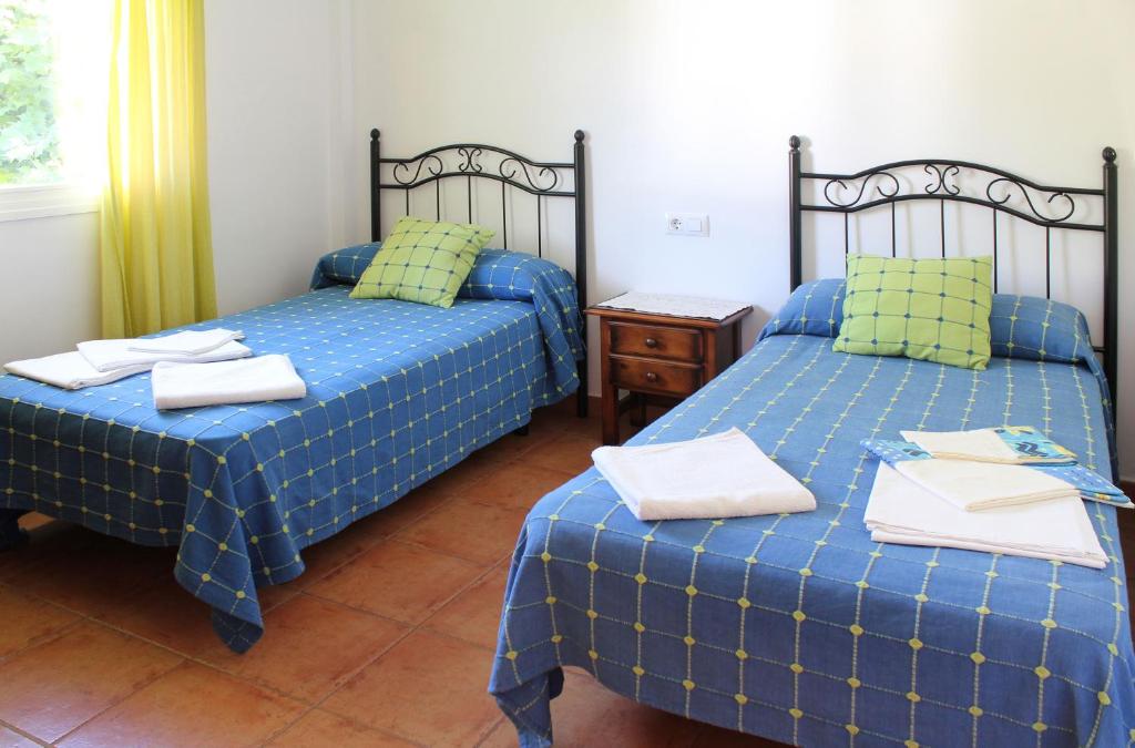 A bed or beds in a room at Casa Gil - La Vega