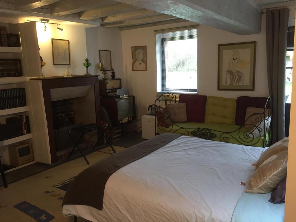 Postel nebo postele na pokoji v ubytování Chambre d’hotes Le Grand Fourneau