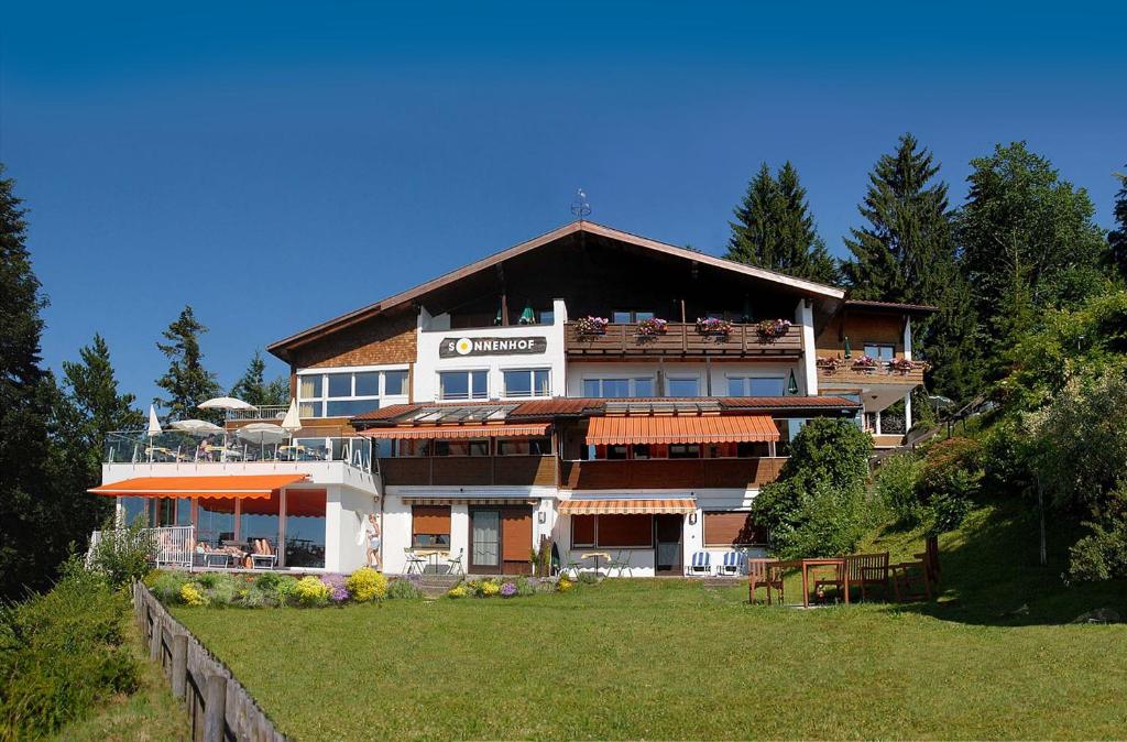 a large house on top of a hill at Hotel Sonnenhof in Eichenberg