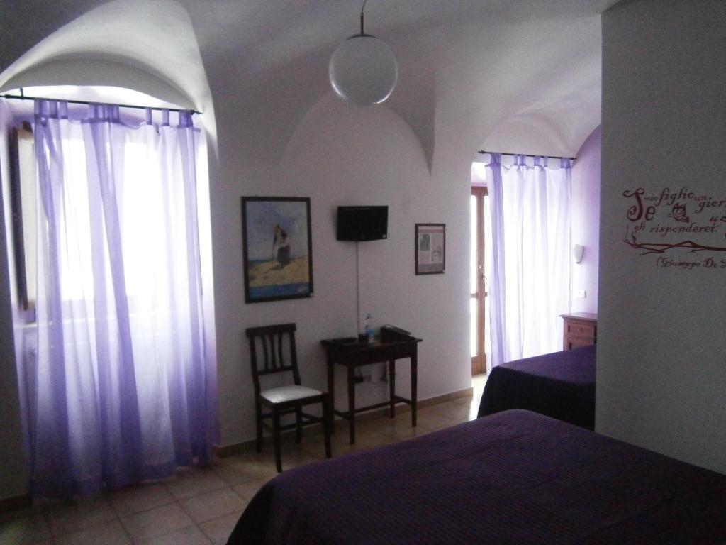 Postel nebo postele na pokoji v ubytování Art Hotel