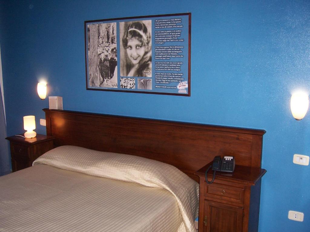 Postel nebo postele na pokoji v ubytování Art Hotel