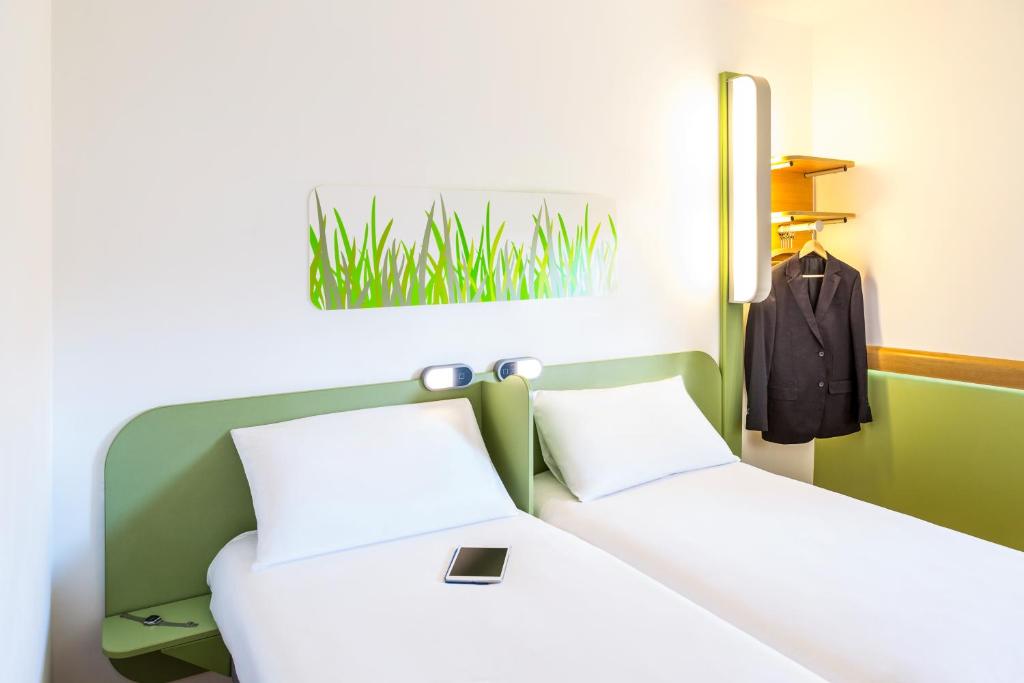 Postel nebo postele na pokoji v ubytování ibis budget Lyon Gerland