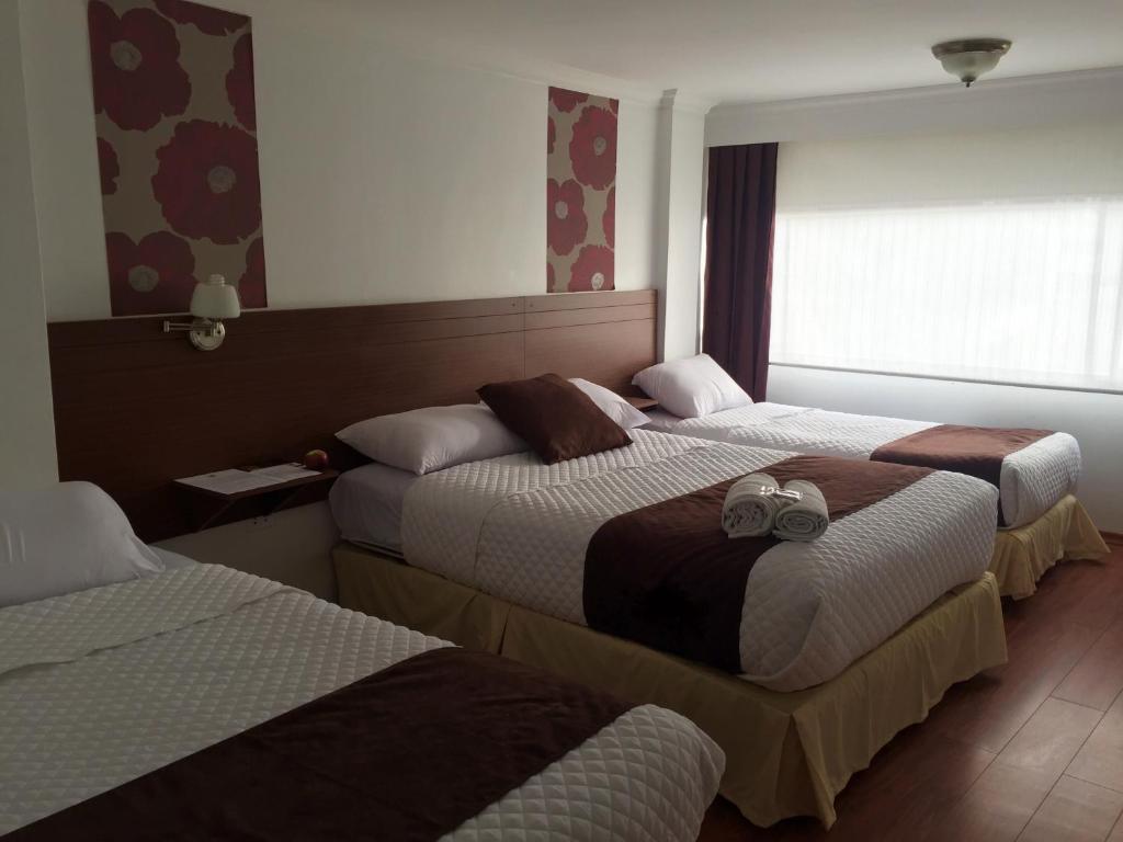 Postel nebo postele na pokoji v ubytování Gran Hotel Napoleón
