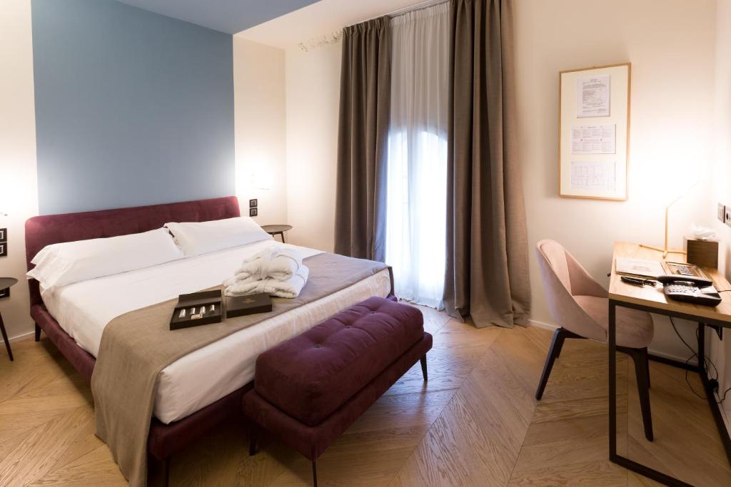Postel nebo postele na pokoji v ubytování Hotel Silla