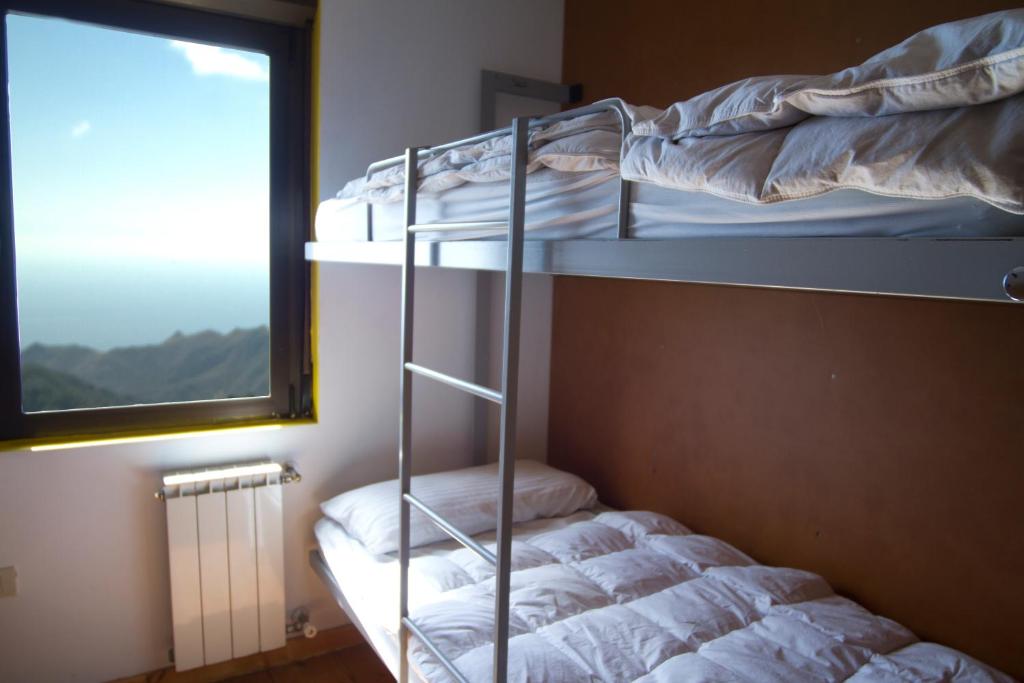 Postel nebo postele na pokoji v ubytování Albergue Montes de Anaga