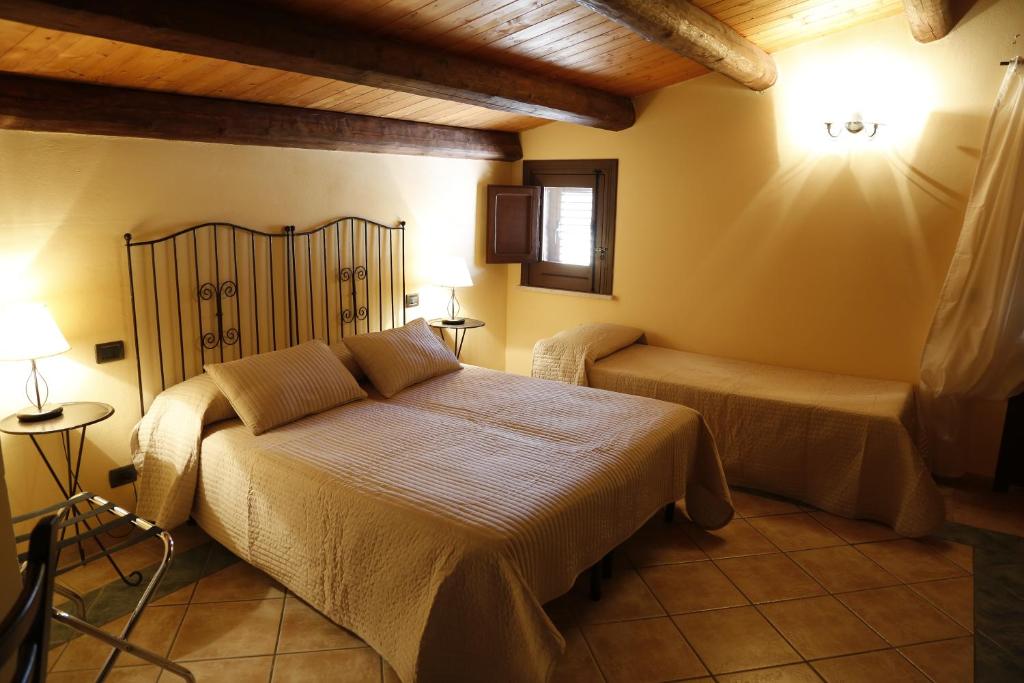 Postel nebo postele na pokoji v ubytování Albergo La Fontanella