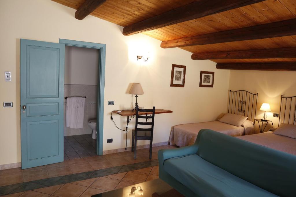 Postel nebo postele na pokoji v ubytování Albergo La Fontanella