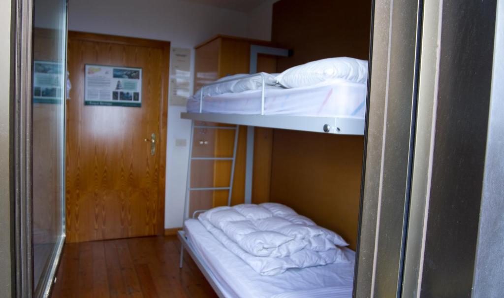 Postel nebo postele na pokoji v ubytování Albergue Montes de Anaga