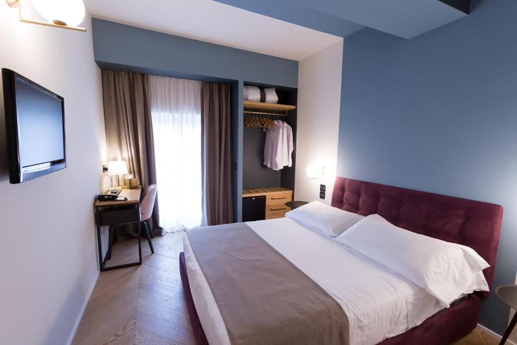 Postel nebo postele na pokoji v ubytování Hotel Silla