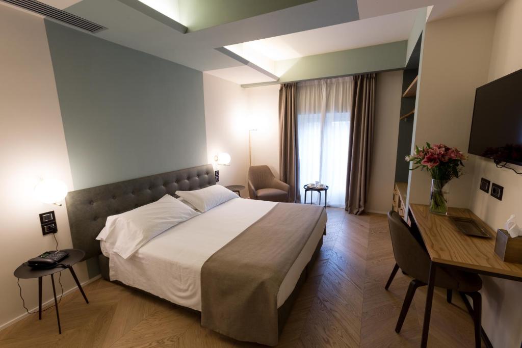 Postel nebo postele na pokoji v ubytování Hotel Silla