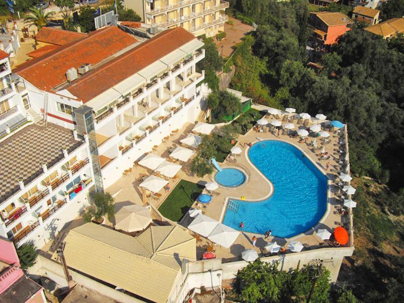 an aerial view of a hotel with a swimming pool at Aloha Hotel in Agios Gordios