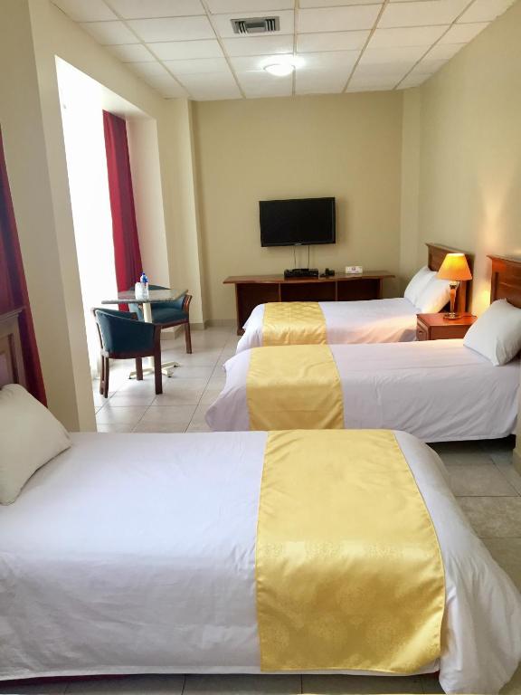 Postel nebo postele na pokoji v ubytování Hotel Las Peñas