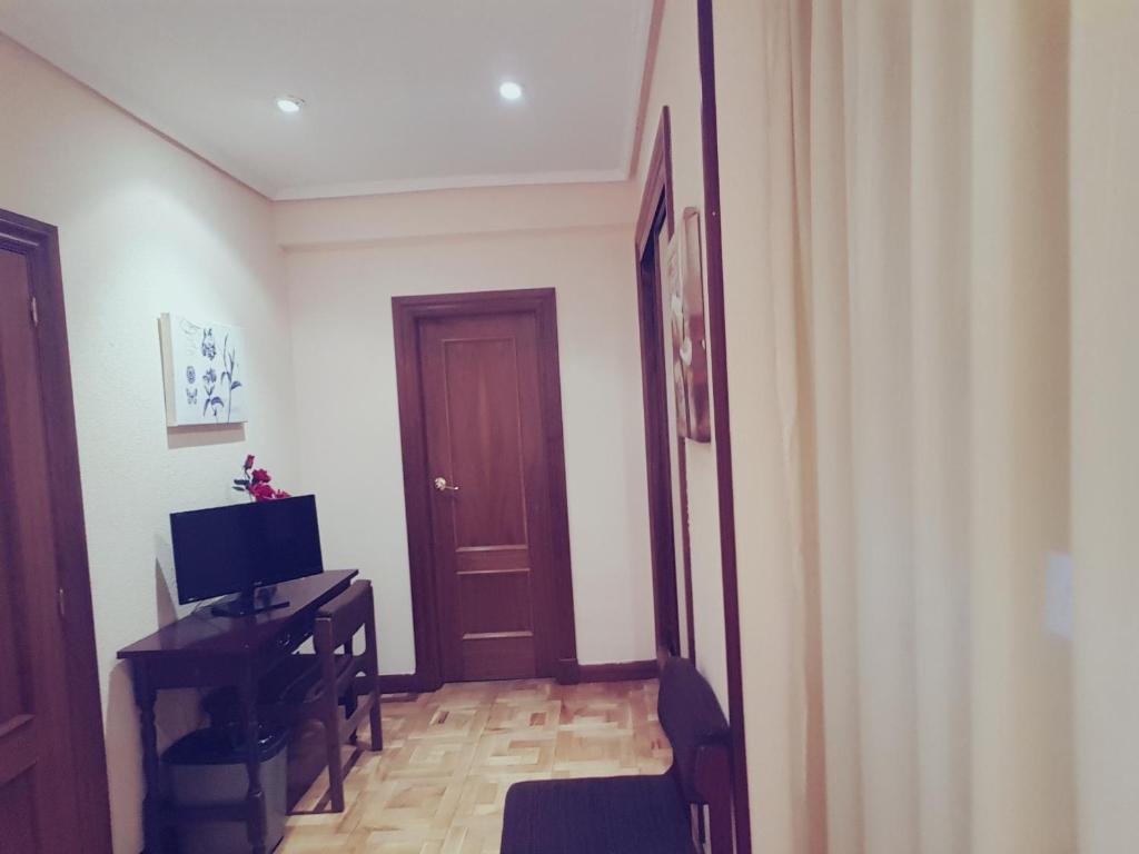 TV a/nebo společenská místnost v ubytování Hotel Castellano I